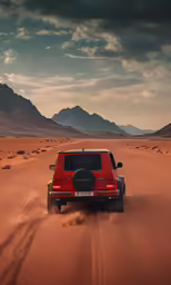 a red pick up truck driving through the desert