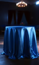 the blue table cloth is draped over the top of it
