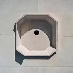 an angled view of cement with a hole inside