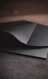 black leather envelope with a smooth corner