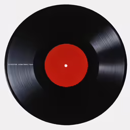 a black and red record sitting on a table