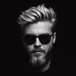 a male with sunglasses and a short blonde hair
