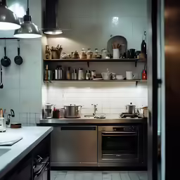 the kitchen is filled with many pots and pans