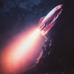 a red rocket launching with its lights on