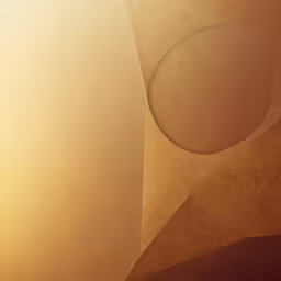 a circular object that is painted brown and light yellow