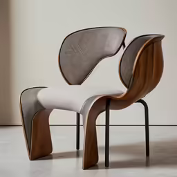 the back side of an unusual chair with a small seat, designed by philippe vanderen