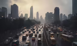 a group of cars driving down a rain soaked road
