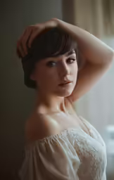 asian woman with short hair posing for picture
