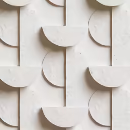 white tiles in a pattern that resembles shapes