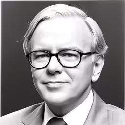 an older man with glasses wearing a suit and tie
