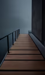 a long wooden walkway stretches out towards the foggy sky
