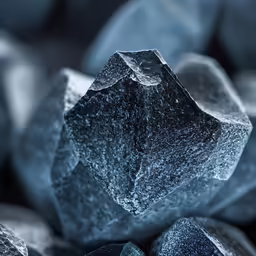the ice is frozen on rocks close up