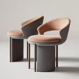 a pair of grey chairs sitting next to each other
