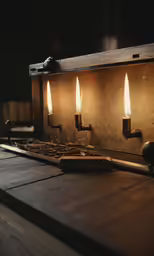 a bunch of lit candles are on a wooden table