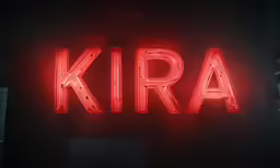 large neon sign for kiro in the dark