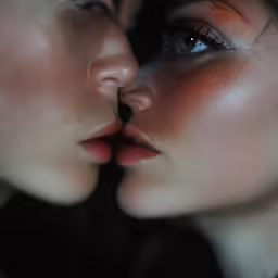 two people with their face to one another