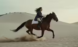 a woman riding on the back of a brown horse