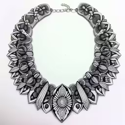 a large black and white drawing of a necklace,this black and white necklace has an elaborate floral design