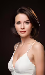 a woman with brown hair wearing a white dress