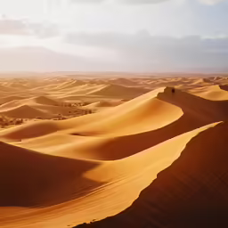a person walking down the side of a sandy mountain