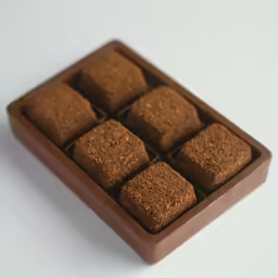 an image of a box of food on white table