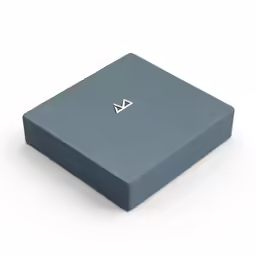 a small box with a square silver symbol on the inside