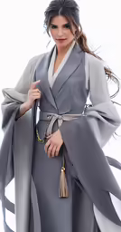 a woman with a grey and white robe and silver dress