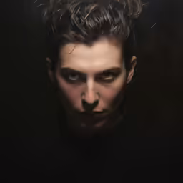 a young man is making an unusual face