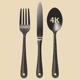 a pair of black utensils sitting on top of each other