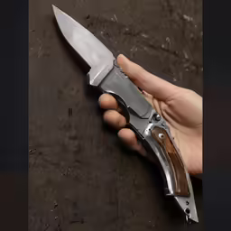 the small knife is next to someone holding it