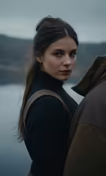 a beautiful woman leaning back and holding onto her shoulder