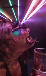 a person is having their face on a glass