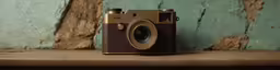 an old camera sitting on the side of a shelf