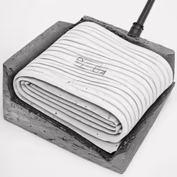 a coil of fabric on top of a square with a black and white image