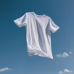 a t - shirt hanging on the clothes line in the blue sky