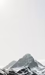 a man with snowboard on a snowy mountain slope