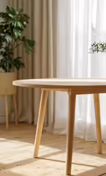 a table in front of curtains with a plant on the top