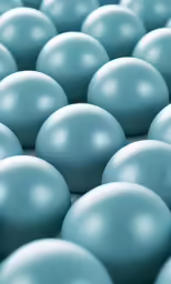 lots of blue balls that are sitting on the ground