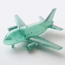 a toy airplane model that is aqua green