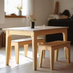 there is a small white table and benches