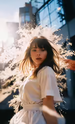 young woman in white shirt standing outdoors with white flowers