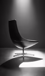a black chair is sitting on a table with its shadow