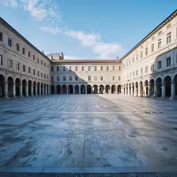 large courtyard area with columns on both sides of buildings