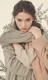 a young woman posing for a photograph while wearing a fur coat