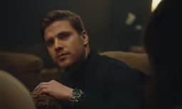 a man staring intently at a lady on the other side
