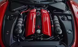 the engine compartment on a red sports car