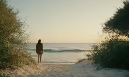 a person is looking out at the ocean