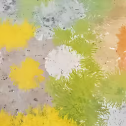 some multicolored stains on a concrete floor