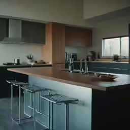 a kitchen with stools and an island with three barstools