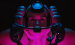 a man with a big bright head lamp in his ears